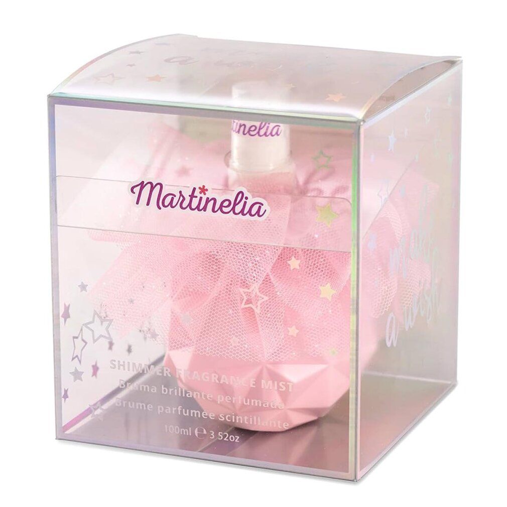 Flacone rosa in scatola trasparente. Scritta Martinelia. Testo: Shimmer Fragrance Mist. Stelle e glitter.