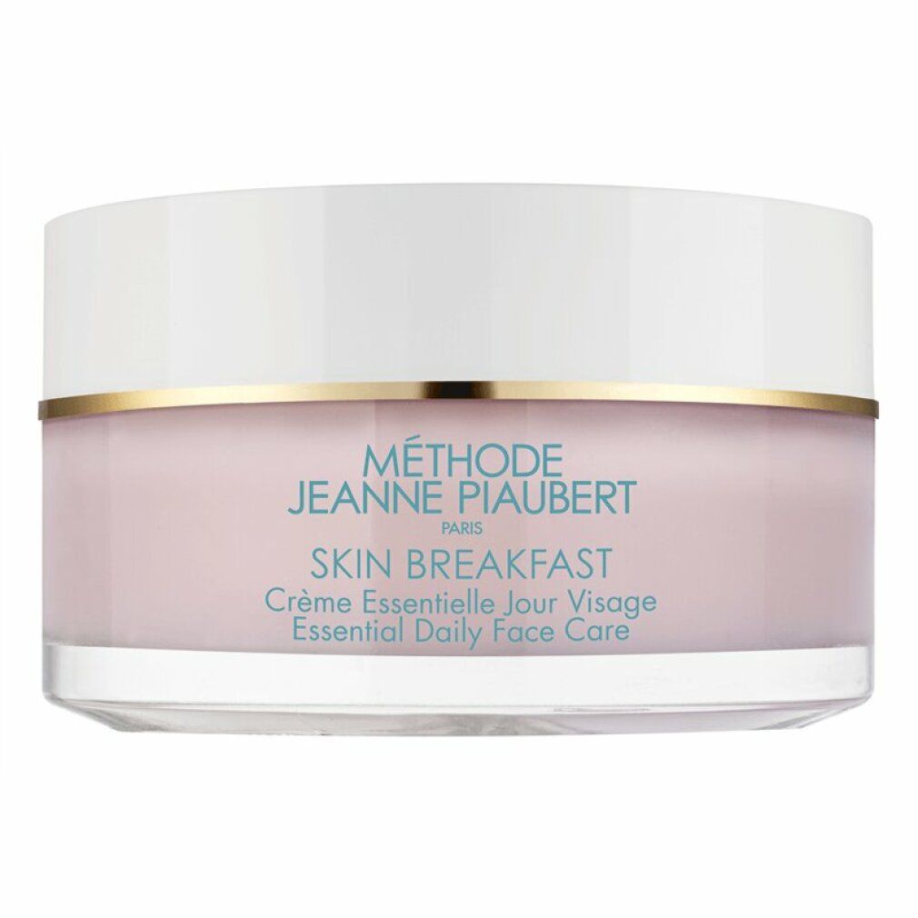Vasetto di crema con coperchio bianco e contenuto rosa. Anello dorato. Scritta SKIN BREAKFAST.