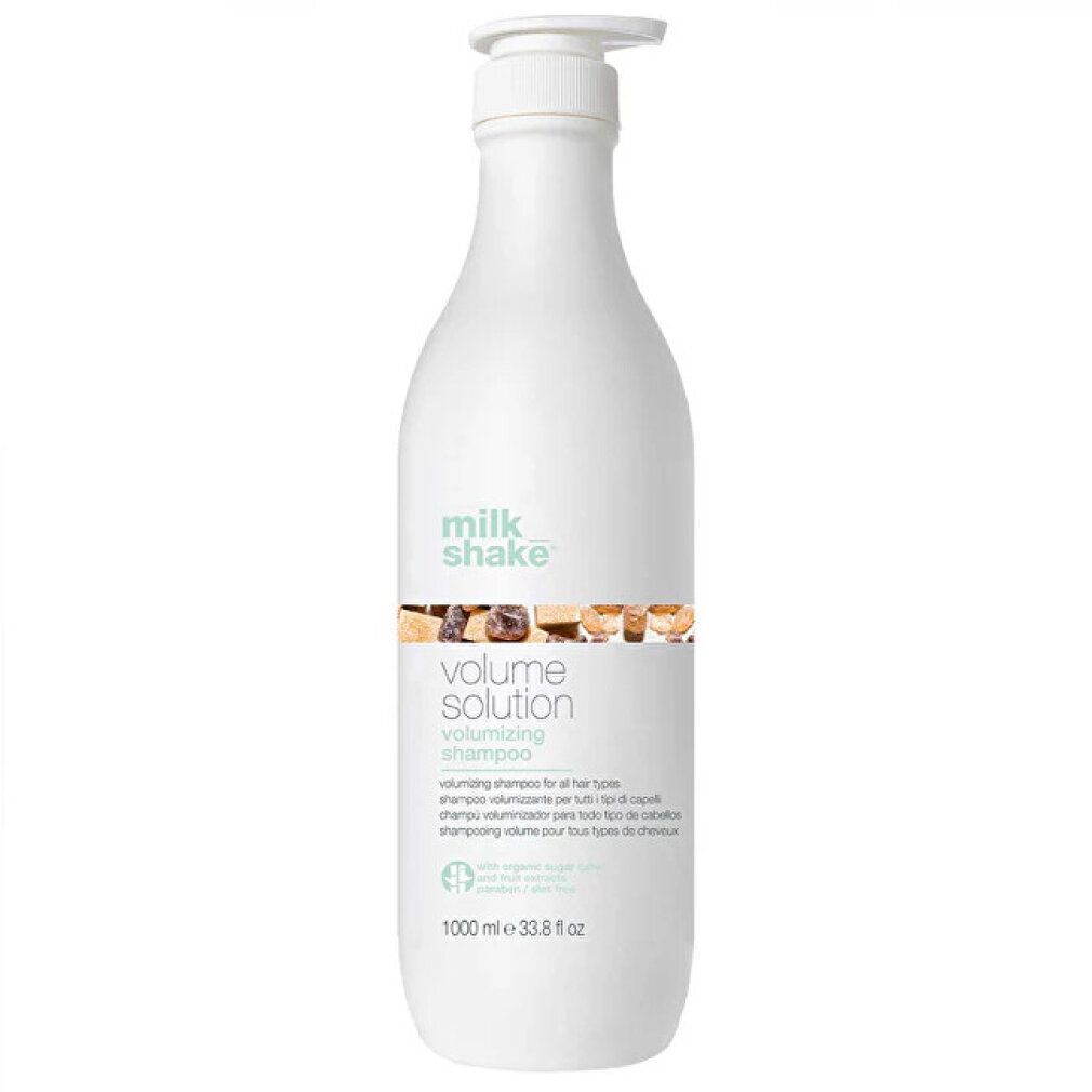 Flacone di shampoo bianco con dosatore a pompa. Scritta: Milk_Shake, Volume Solution, volumizing shampoo. 1000 ml.