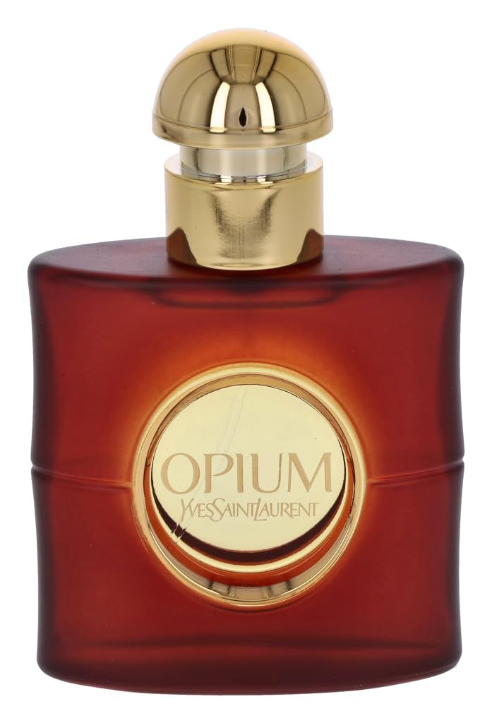 Flacone rosso con tappo dorato. Etichetta rotonda con "Opium Yves Saint Laurent".