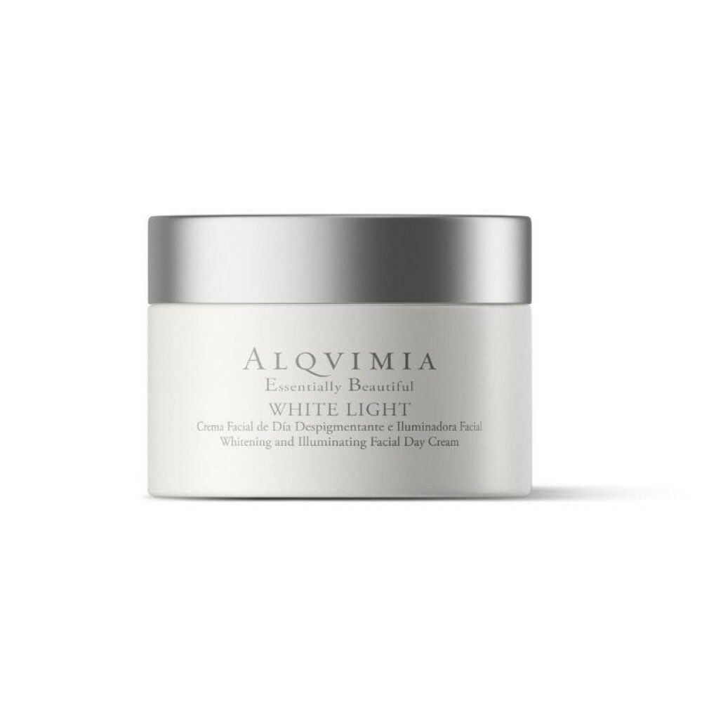 Vasetto di crema con coperchio argentato. Scritta: Alqvimia, White Light. Testo sottostante: Crema Facial de Día Despigmentante e Iluminadora Facial.