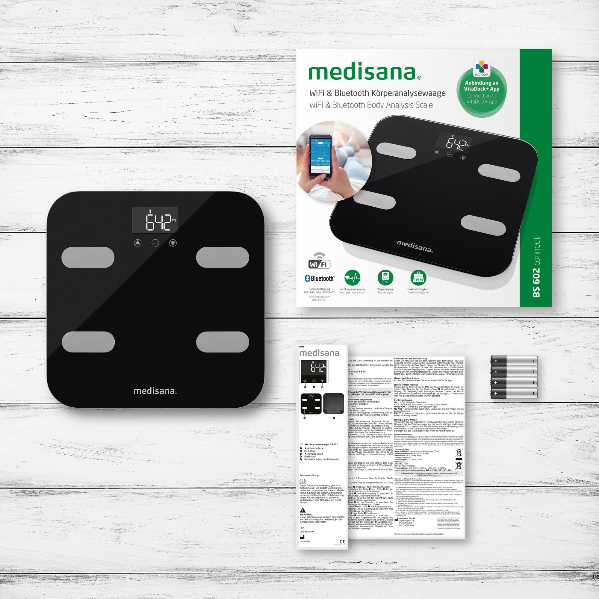 Confezione e accessori di una bilancia per analisi corporea: bilancia, manuale, batterie.