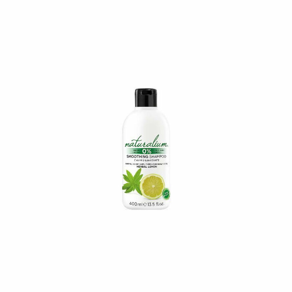 Flacone bianco con tappo nero. Scritta: Naturalium 0% Smoothing Shampoo Herbal Lemon. Immagine: limone e foglia.
