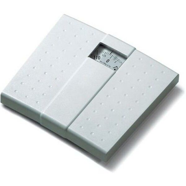 Bilancia meccanica bianca. Forma quadrata, display analogico. Superficie con borchie. Scala fino a 110 kg.