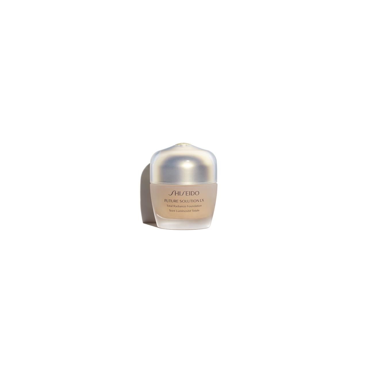 Fondotinta Shiseido Future Solution LX. Flacone beige con coperchio. Scritta e nome del prodotto.