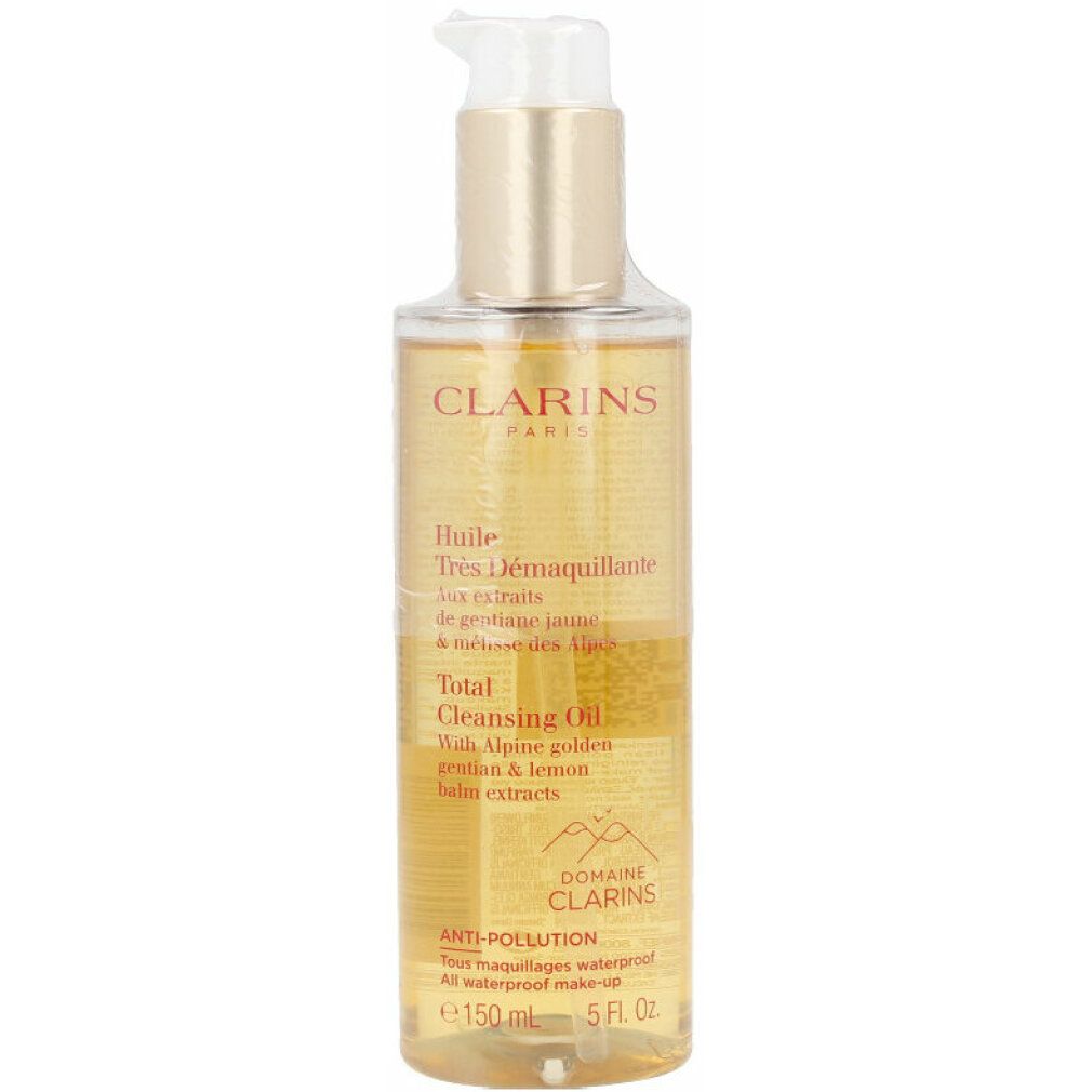 Flacone trasparente con liquido dorato e dosatore. Scritte: Clarins Total Cleansing Oil, 150 ml.