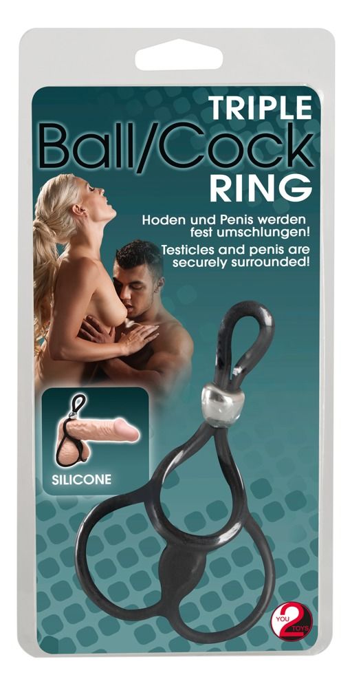 Confezione con immagine del prodotto. Anello nero con connettore argentato. Testo: Triple Ball/Cock Ring.