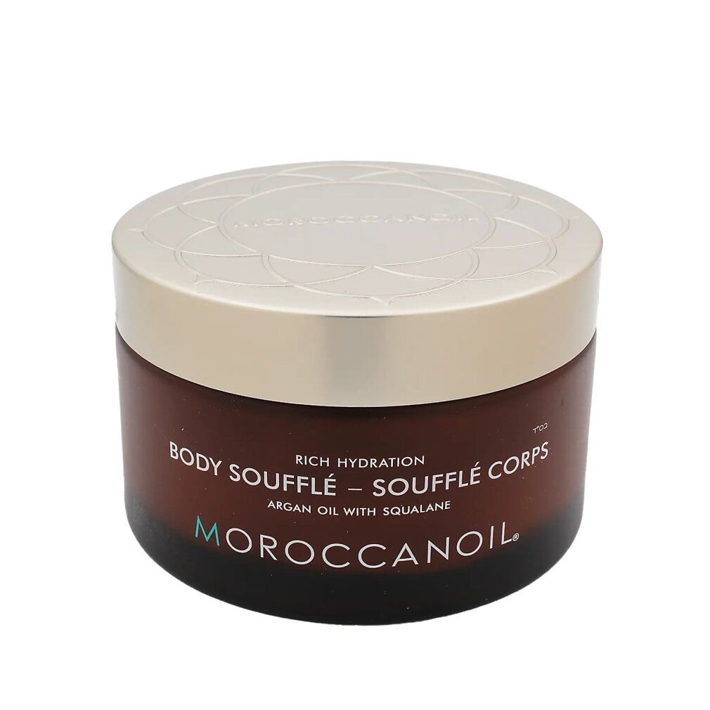 Vaso marrone con coperchio dorato. Scritta: Body Soufflé, olio di argan con squalano. Marchio: Moroccanoil.