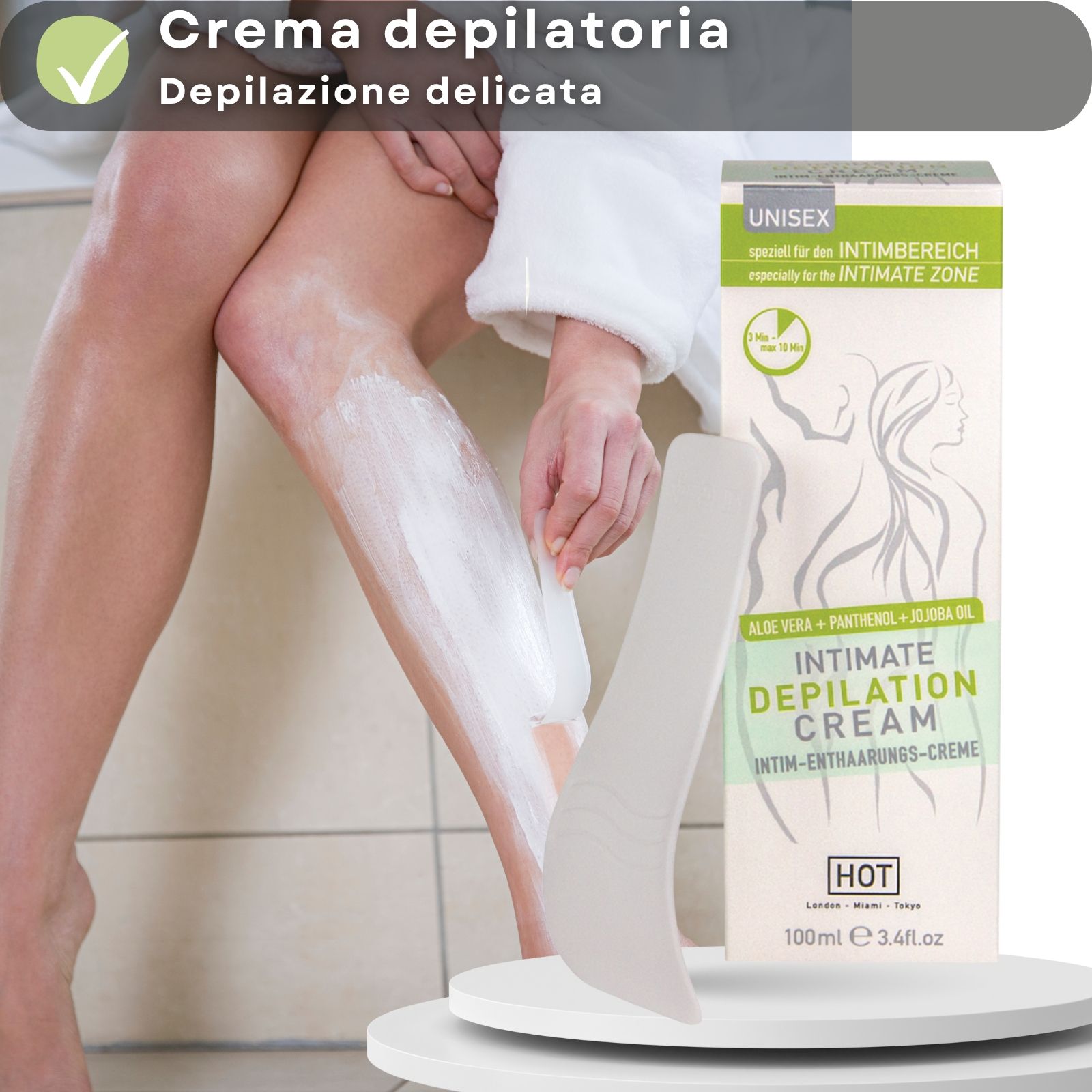 Tubo e scatola di crema. Scritta: INTIMATE DEPILATION CREAM. Marca: HOT. Con spatola. Applicato sulla pelle. Testo: Crema depilatoria.