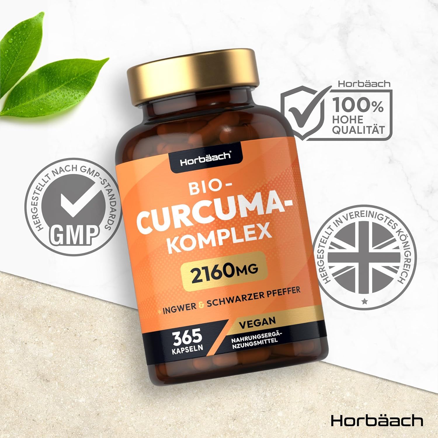 Flacone marrone di capsule. Scritta: Bio-Curcuma-Komplex 2160mg, Zenzero + Pepe nero, 365 capsule, Vegan. Sigillo GMP.