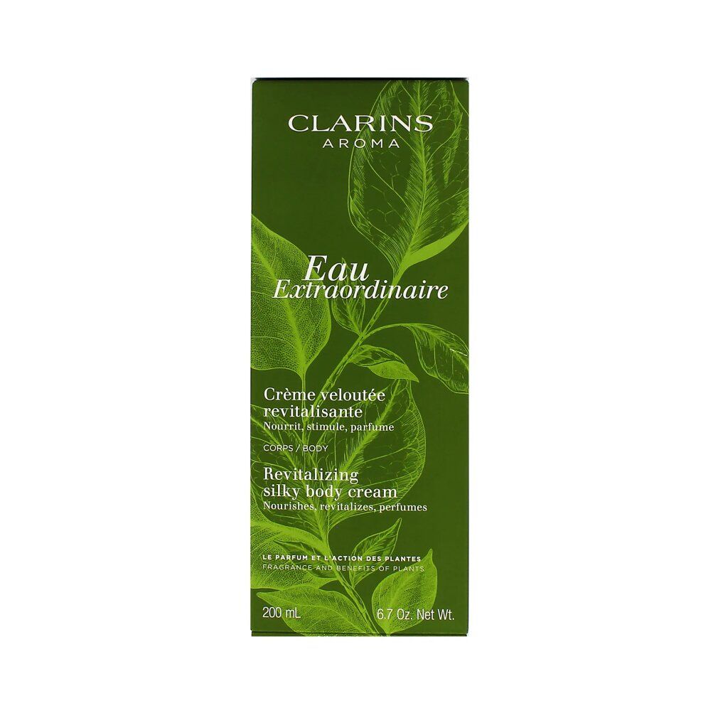 Scatola verde con motivo a foglie. Testo: Clarins Aroma, Eau Extraordinaire, Crème veloutée revitalisante, 93% ingredienti di origine naturale.