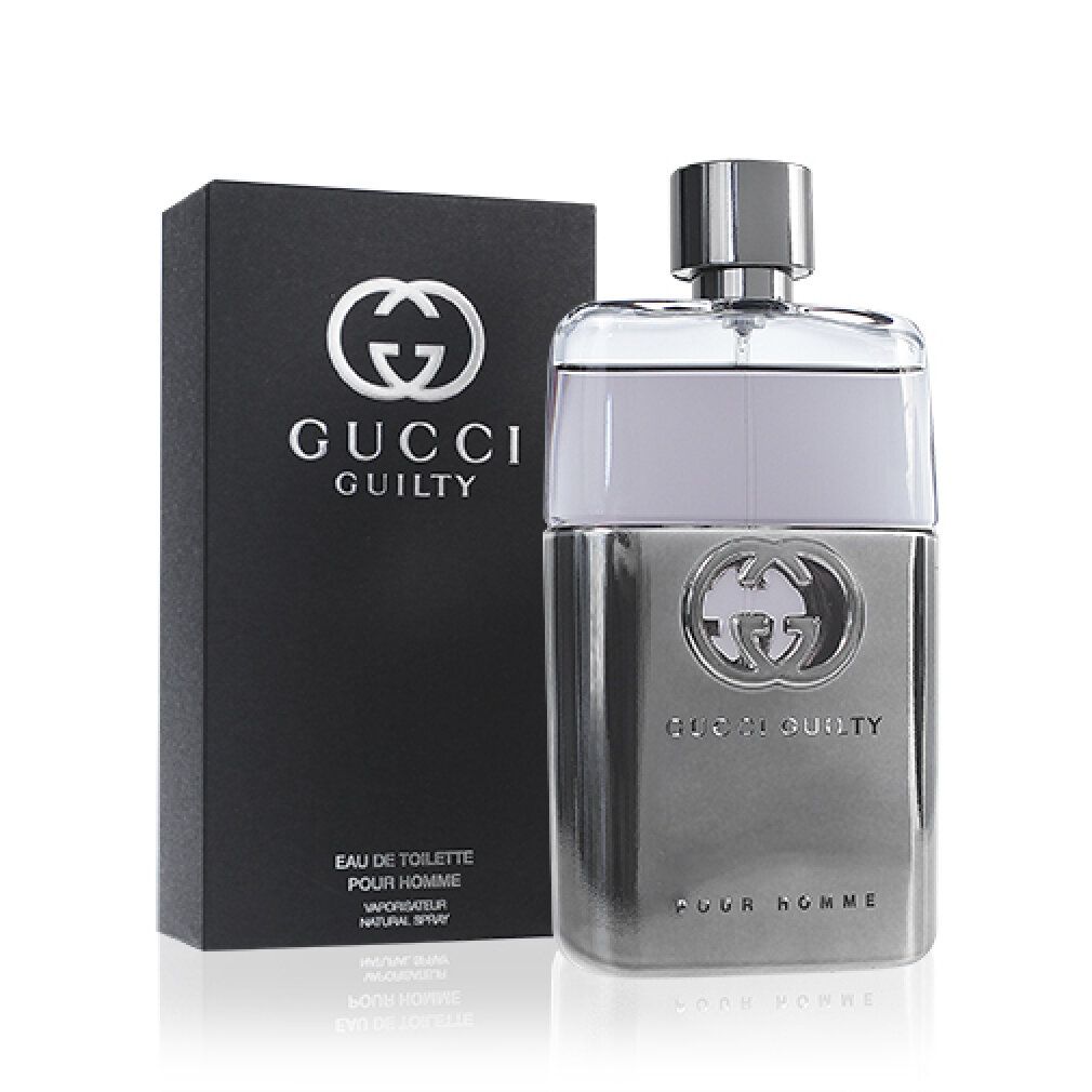 Flacone Gucci Guilty Pour Homme e scatola nera. Flacone argentato con logo. Scatola nera con logo e testo.