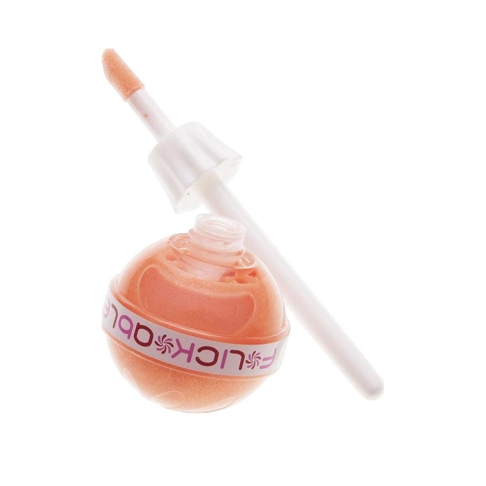 Lucidalabbra a forma di lecca-lecca, aperto. Contenitore sferico con bastoncino. Scritta: F*LICKable. Tonalità arancione.