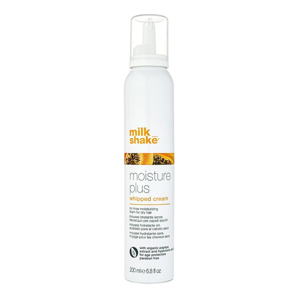 Spray bianco con nome e designazione del prodotto. Scritta: Milk Shake Moisture Plus Whipped Cream. Con estratto di papaya.