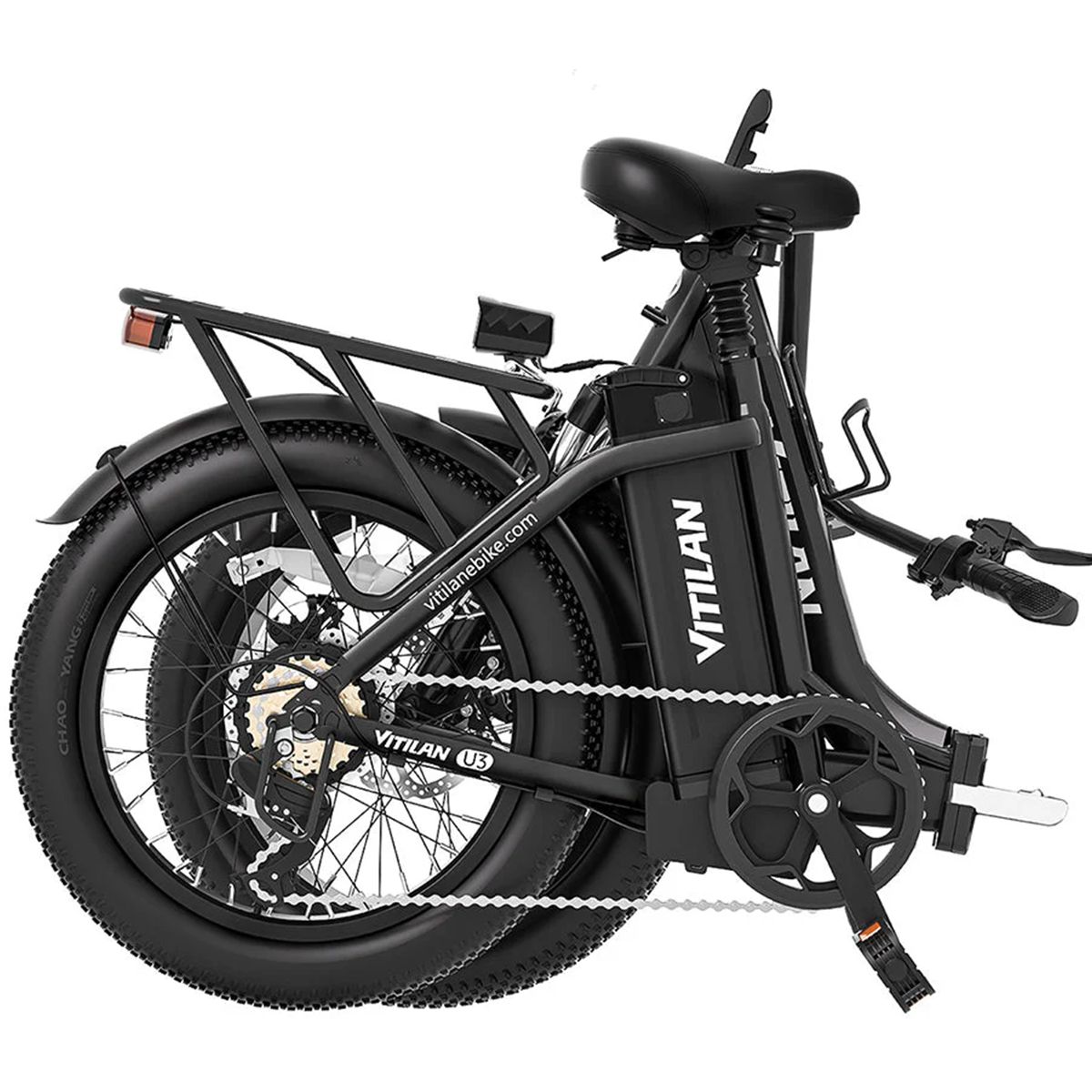 Bicicletta elettrica nera piegata con pneumatici larghi. Marchio VITILAN.