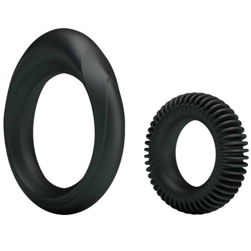 Due anelli neri. Un anello con una forma rialzata, l'altro con superficie scanalata. In silicone.