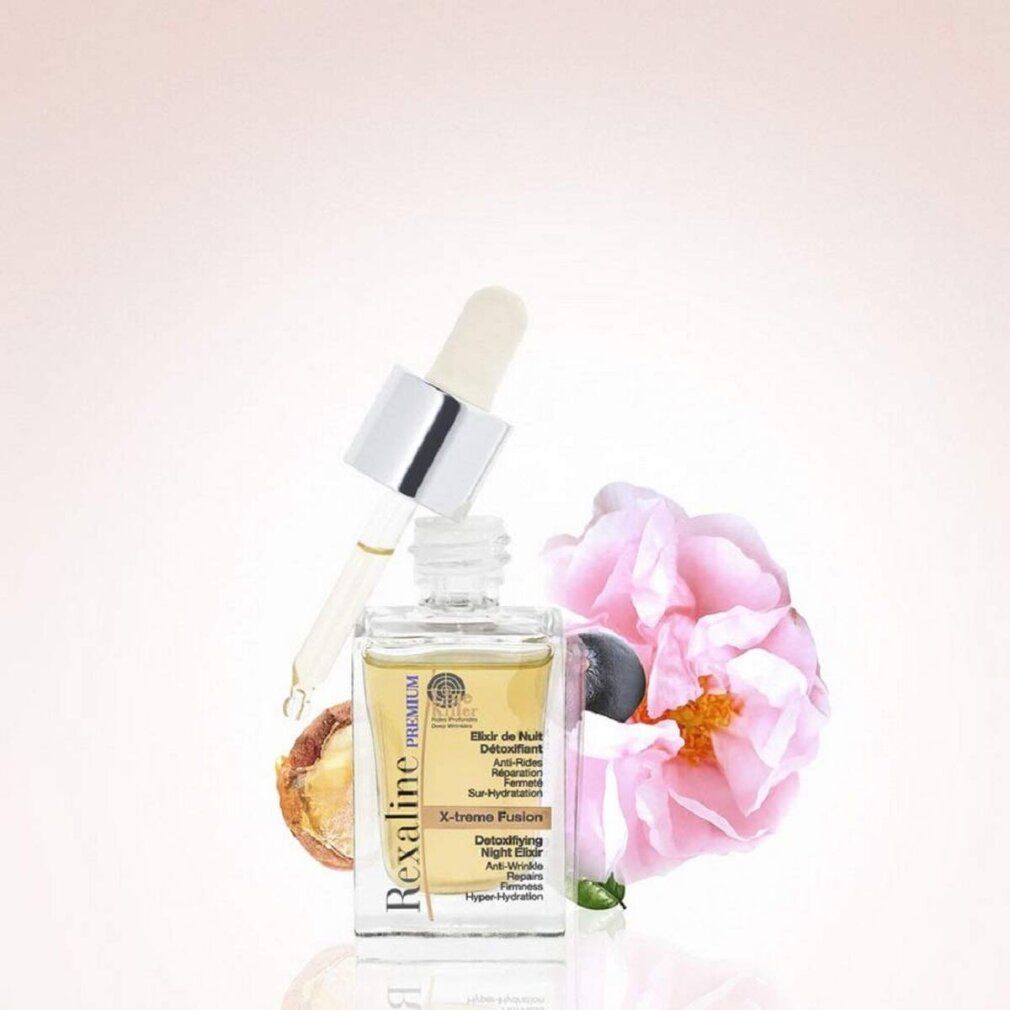 Flacone di vetro con pipetta, circondato da fiori e noci. Scritta: Rexaline Premium, Elixir de Nuit Détoxifiant, X-treme Fusion.