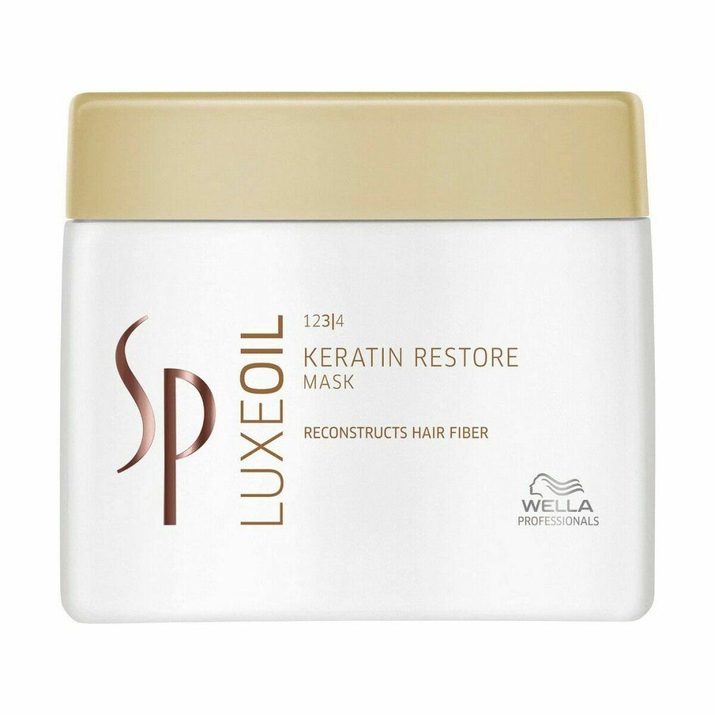 Vaso bianco con coperchio dorato. Scritta: Luxeoil Keratin Restore Mask. Logo Wella Professionals.