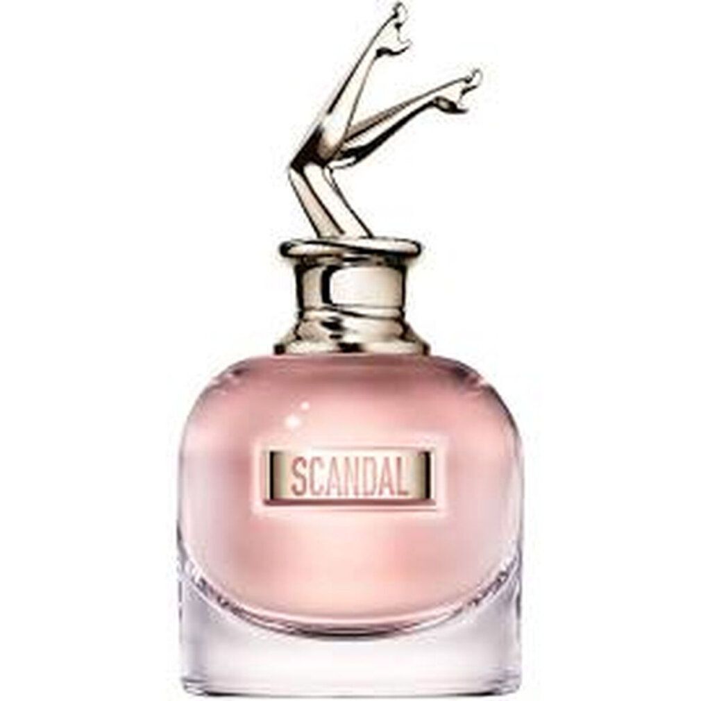 Flacone di profumo con tappo a forma di gambe dorate. Scritta "SCANDAL". Flacone in vetro.
