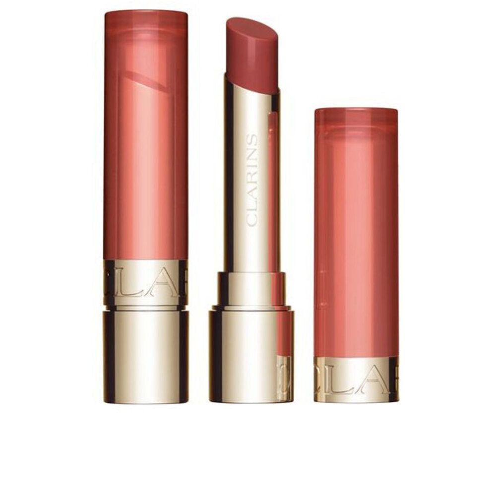 Balsamo per labbra, aperto e chiuso. Contenitore dorato con rossetto rosa. Marchio Clarins visibile.