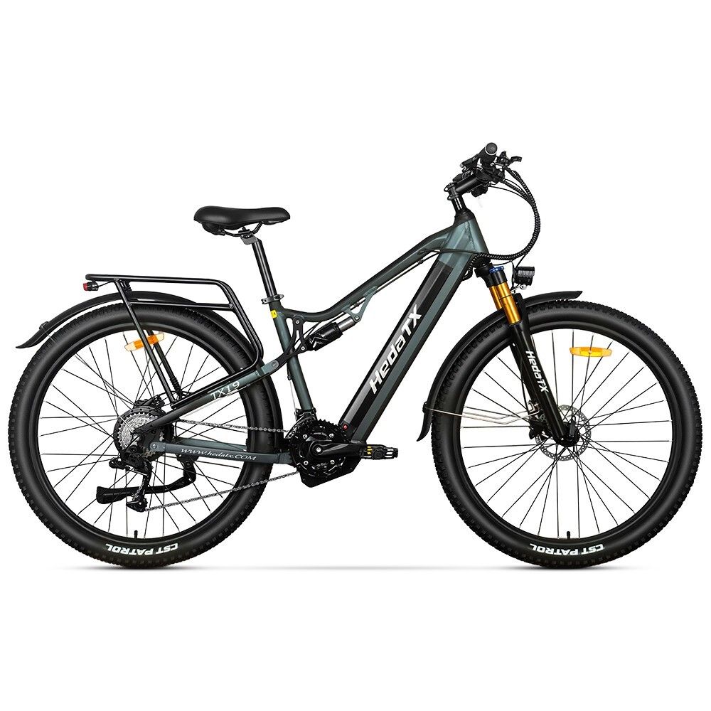 E-bike grigio HedaTX TX19. Pneumatici neri, portapacchi, sospensioni. Forcella gialla. 27 velocità. Scritta HedaTX.