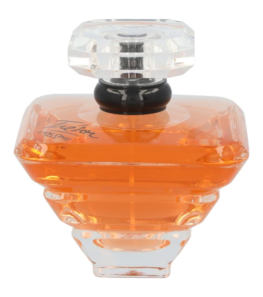 Flacone di profumo in vetro ambrato, tappo trasparente. Scritta Trésor e Lancôme.