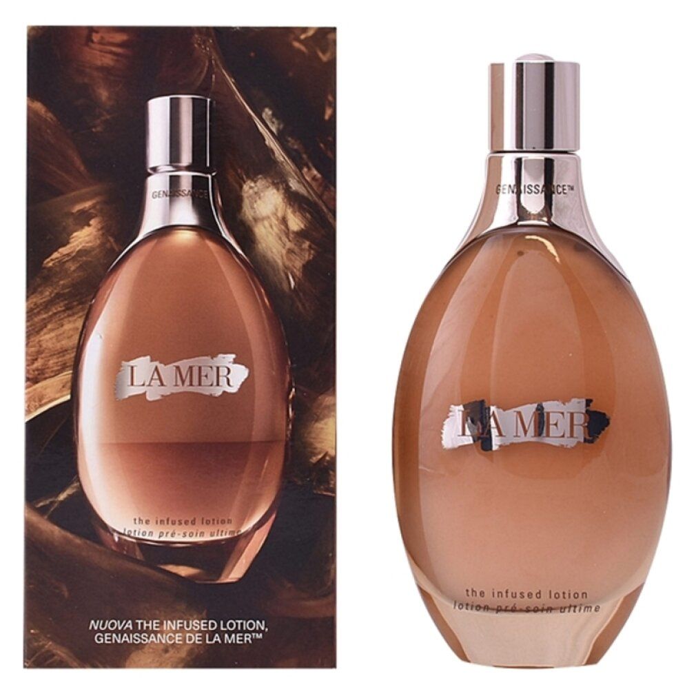 Flacone marrone con tappo dorato e confezione. Scritta "LA MER". Visibili "The infused lotion" e "lotion pré-soin ultime".