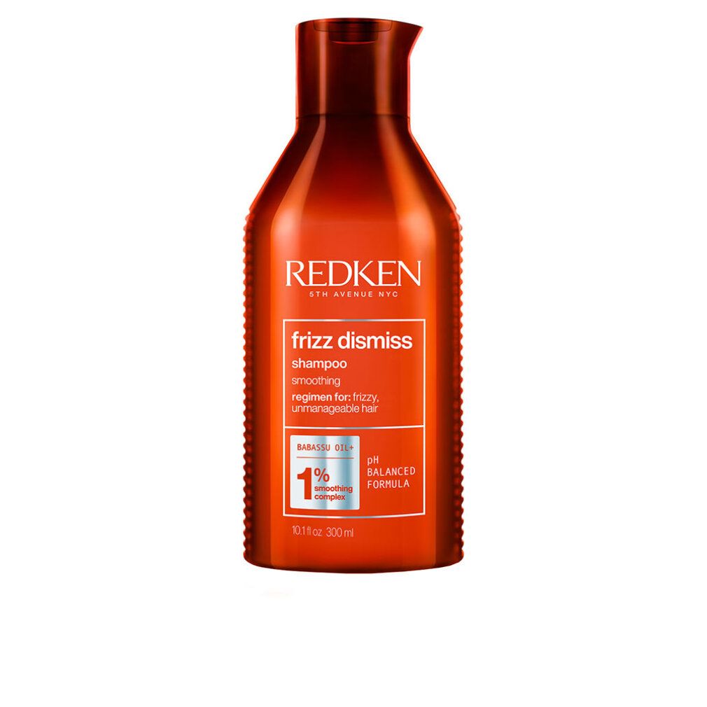 Flacone rosso di shampoo Redken Frizz Dismiss. Testo: Frizz Dismiss, Shampoo, formula pH bilanciata, 1% Smoothing Complex.