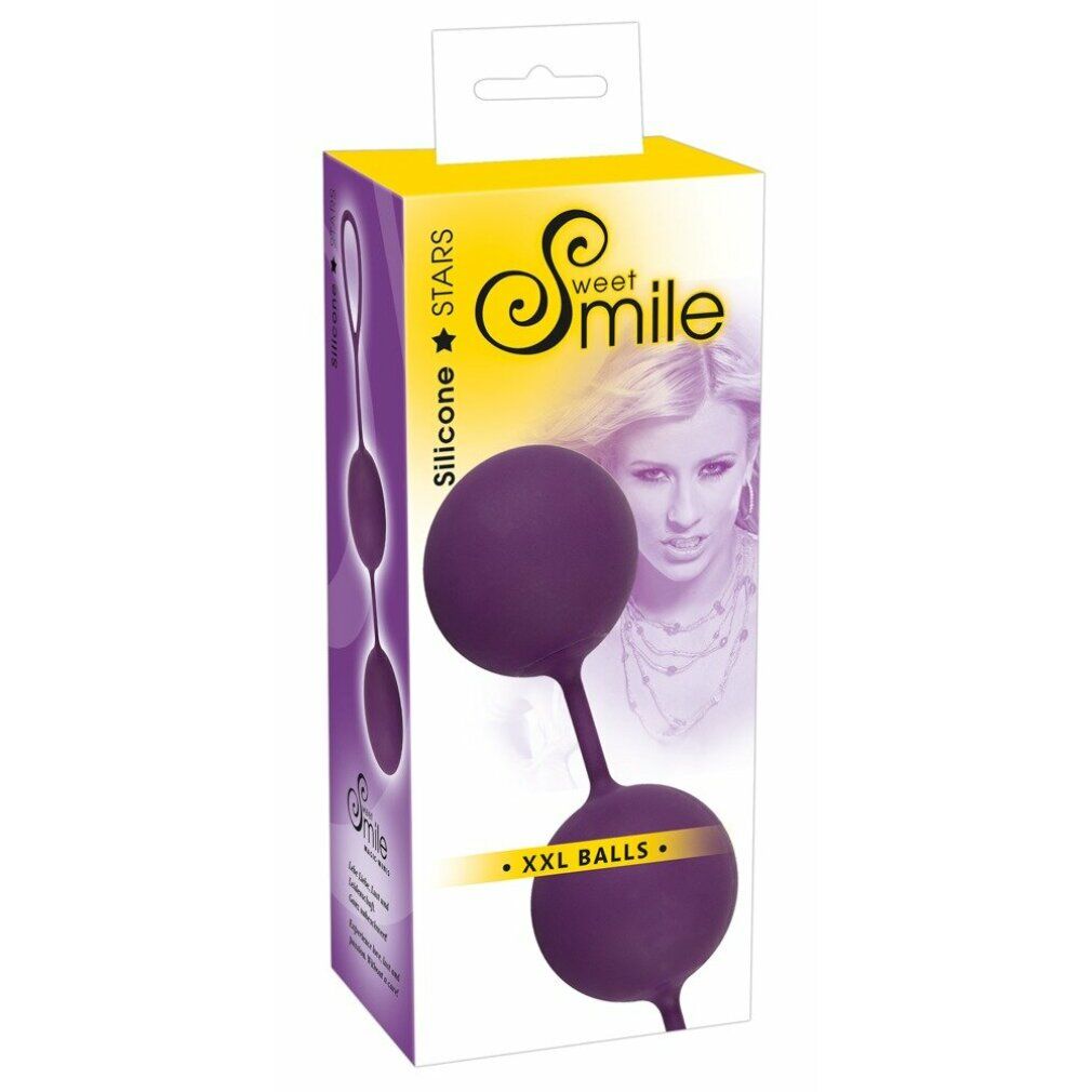 Confezione con due palline dell'amore viola. Scritta: Sweet Smile, XXL Love Balls. Scatola giallo-viola con immagine del prodotto e volto femminile.