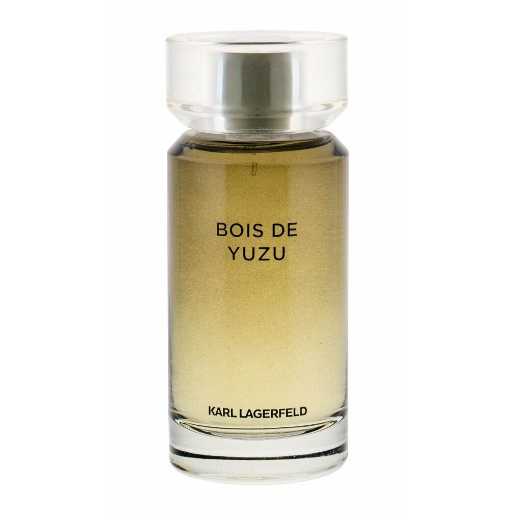 Flacone in vetro con profumo chiaro, scritta "BOIS DE YUZU" e "KARL LAGERFELD".