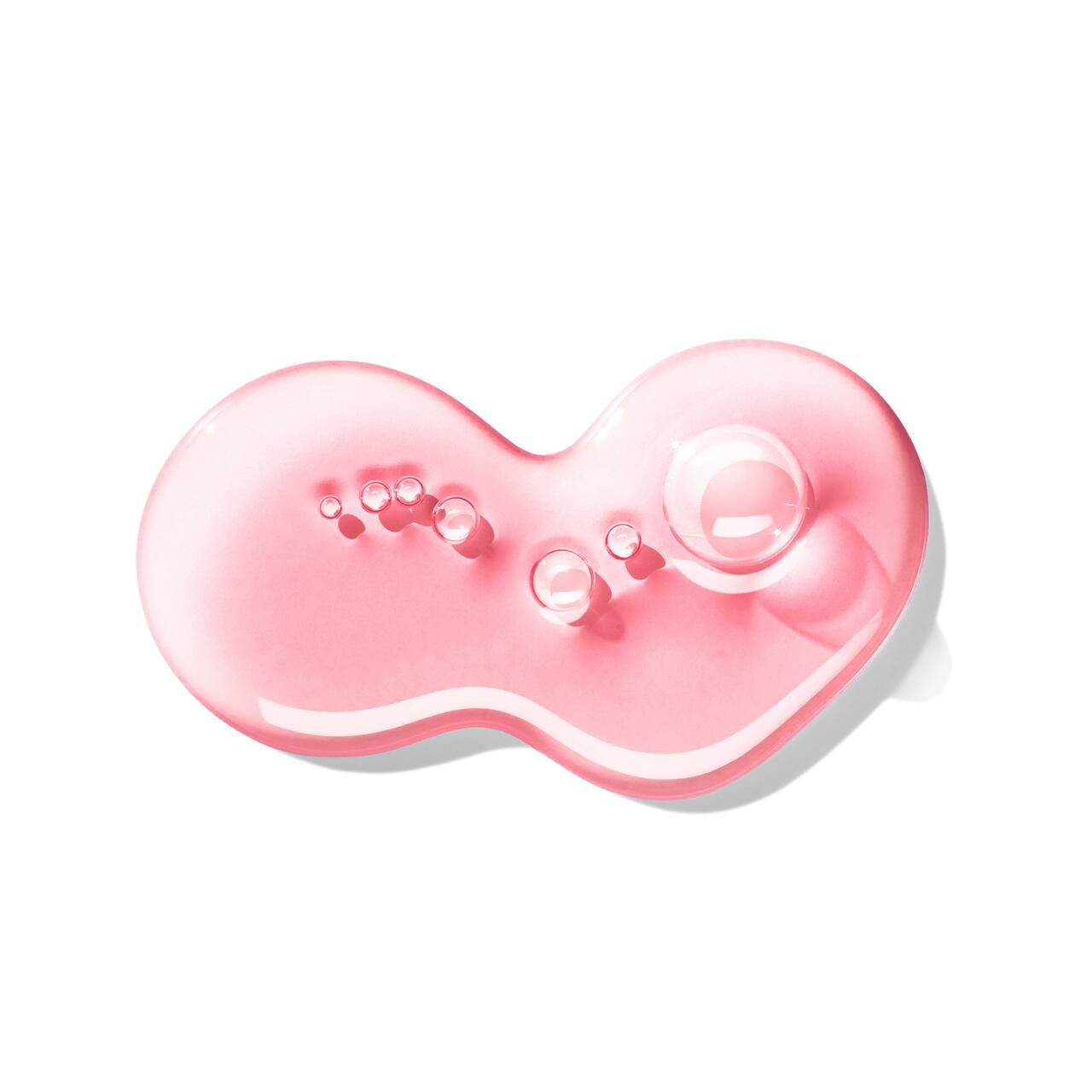 Liquido rosa con bolle. Su sfondo bianco. Forma: goccia. Texture: liscia. Prodotto: Molton Brown Fiery Pink Pepper Handseife.