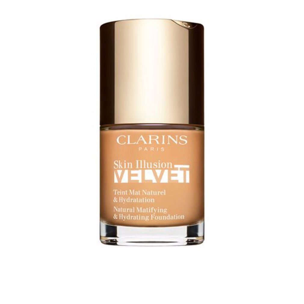 Fondotinta Clarins Skin Illusion Velvet. Flacone con tappo dorato. Testo: Teint Mat Naturel & Hydratation.