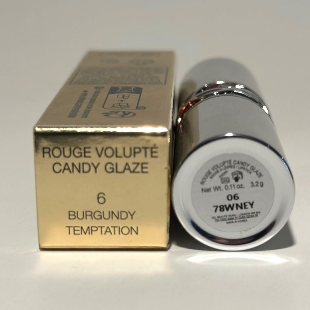 Rossetto e confezione dorata. Scritta: Rouge Volupté Candy Glaze, tonalità 06 Burgundy Temptation.