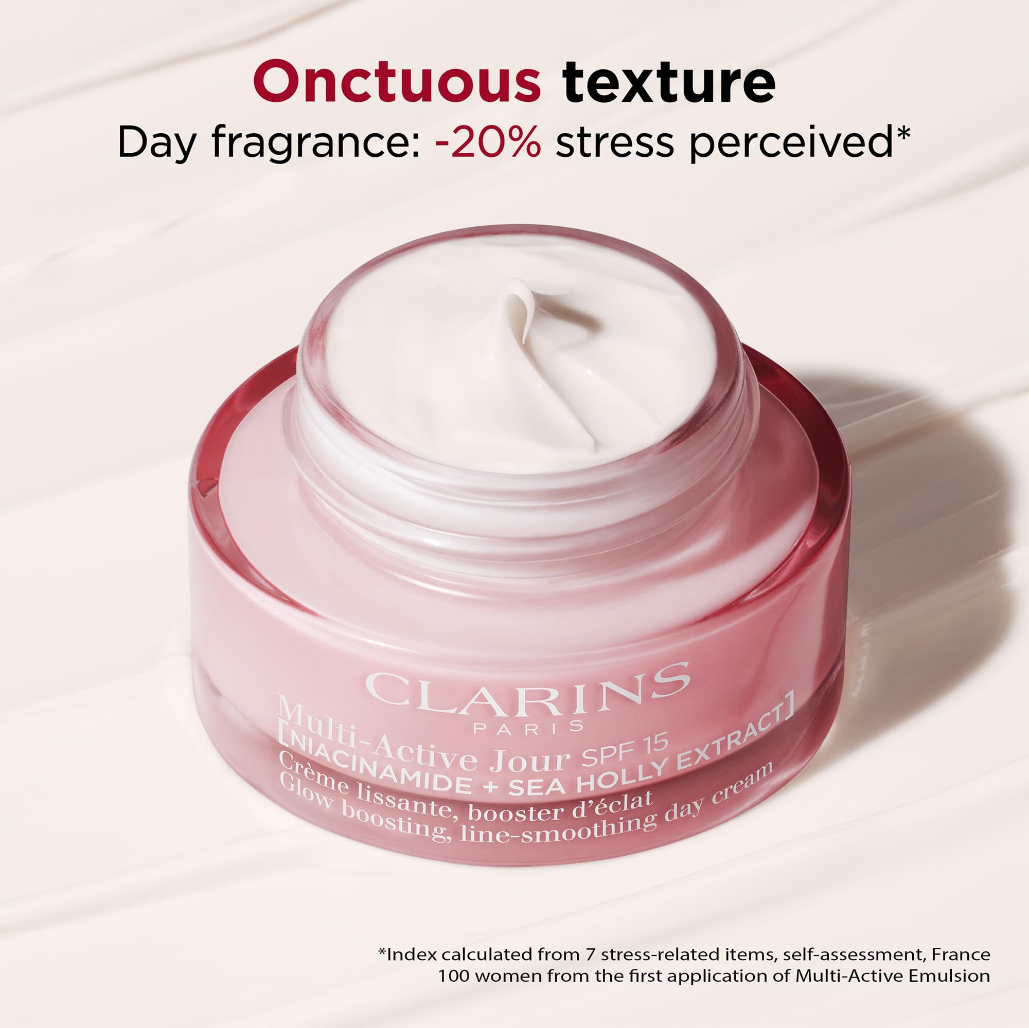Vasetto di crema aperto con crema bianca. Scritta: Clarins, Multi-Active Jour SPF15. Testo: Crème lissante, booster d'éclat.
