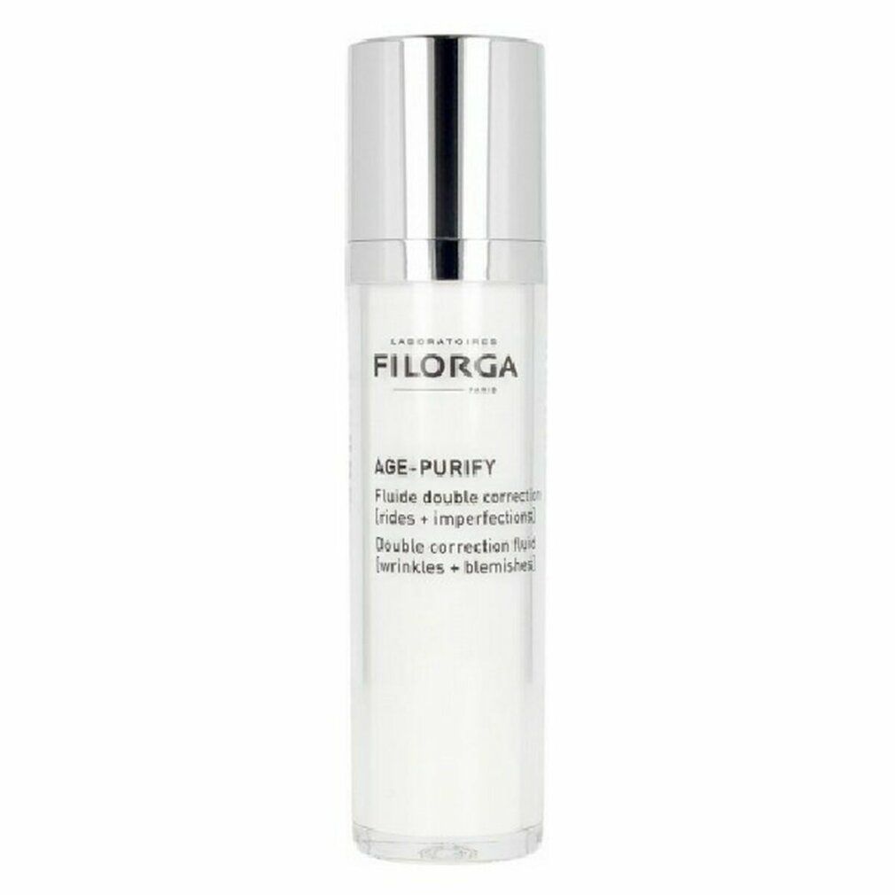 Flacone bianco Filorga Age-Purify Fluid, tappo argento. Testo: Age-Purify, rughe, imperfezioni. Laboratoires Filorga Paris.