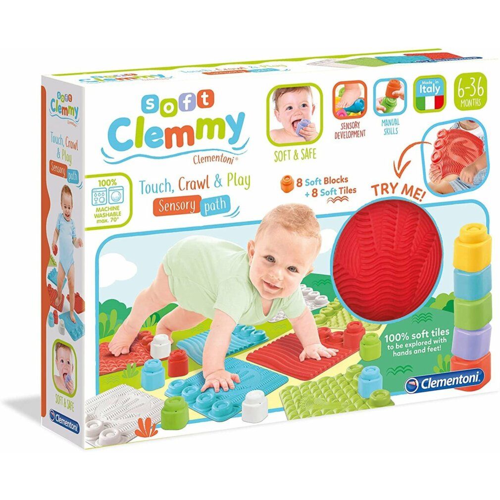 Confezione gioco Clemmy. Include blocchi morbidi, piastrelle e una palla rossa. Bambino che gattona sul tappeto. Testo: Soft Clemmy, 6-36 mesi.
