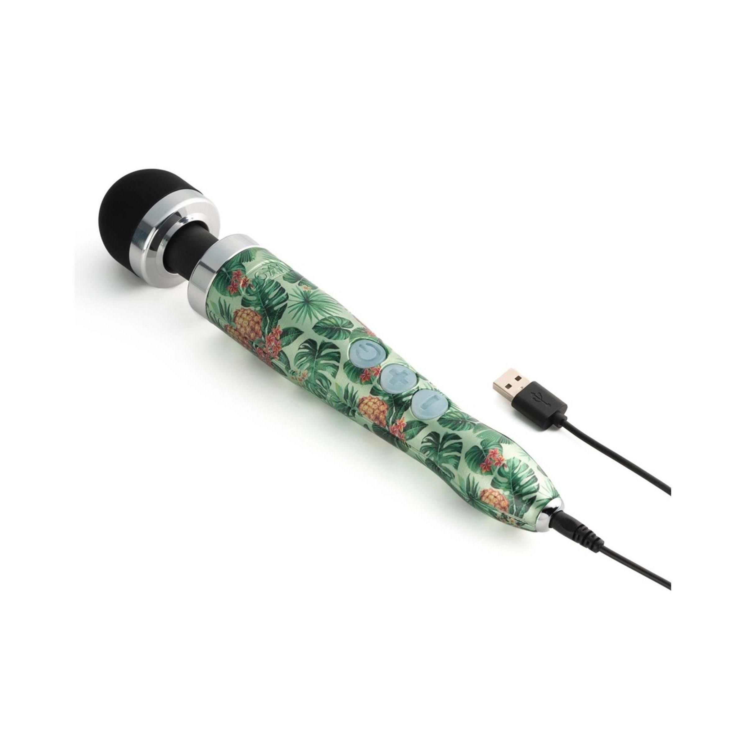 Vibratore con testa nera e manico verde con motivo ananas e foglie. Tre pulsanti. Cavo USB.