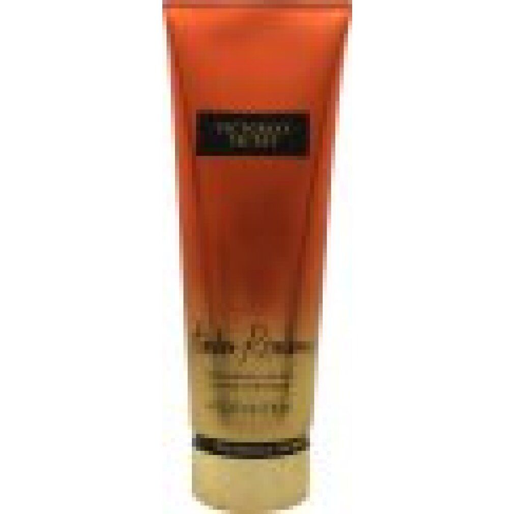 Lozione per il corpo Victoria's Secret Amber Romance. Tubo arancione con etichetta nera. Nome del prodotto e marchio visibili.