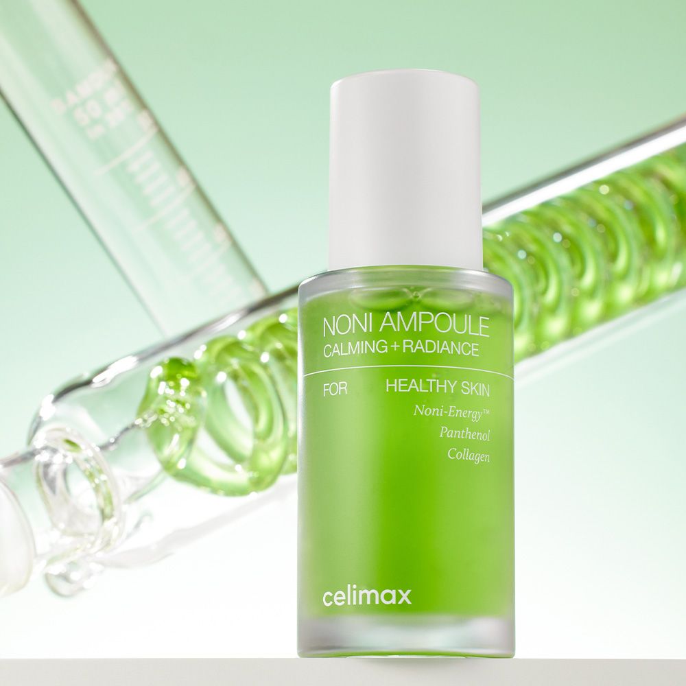 Fiala Celimax Noni Energy davanti a un contenuto verde a spirale.