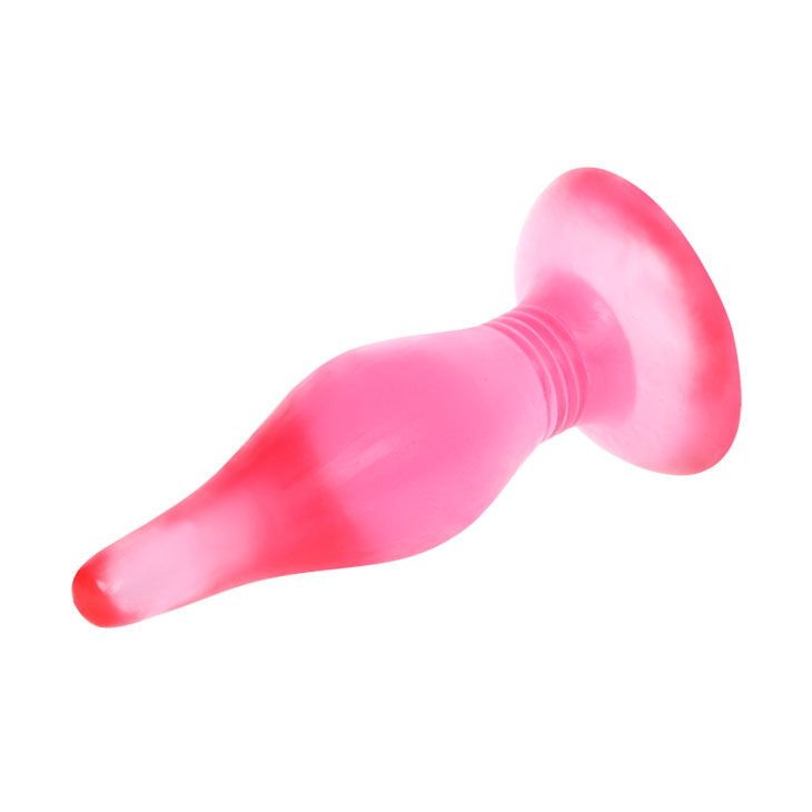 Tappo anale rosa con base larga e stelo scanalato, di lato.
