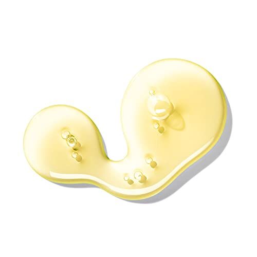 Liquido giallo, presumibilmente sapone, su sfondo bianco. Sono visibili alcune bolle.