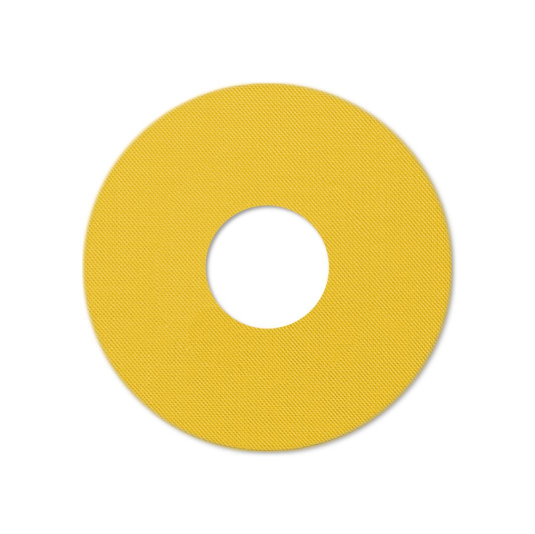 Anello di fissaggio giallo, circolare, con foro centrale. Tessuto.