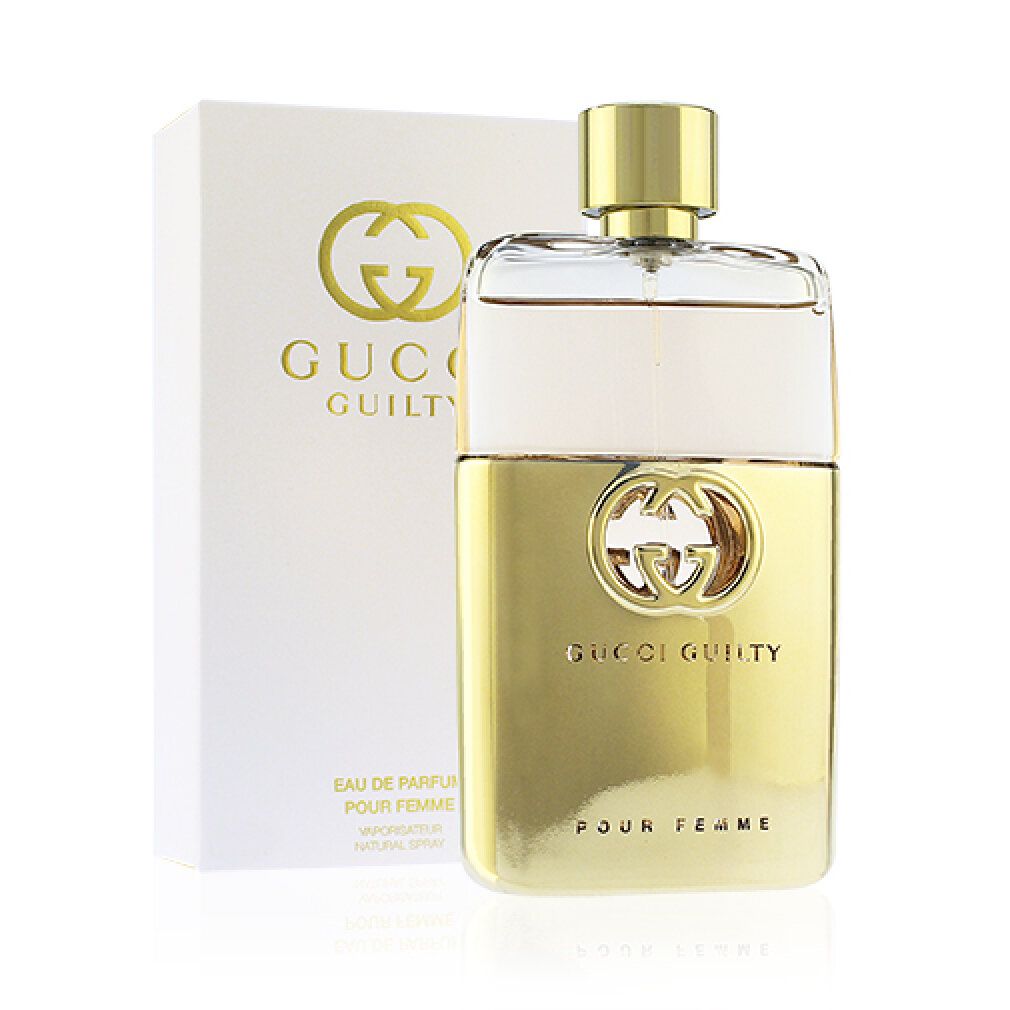 Flacone dorato e confezione. Gucci GUILTY POUR FEMME, 50 ml, 1.6 FL.OZ. Scritta.