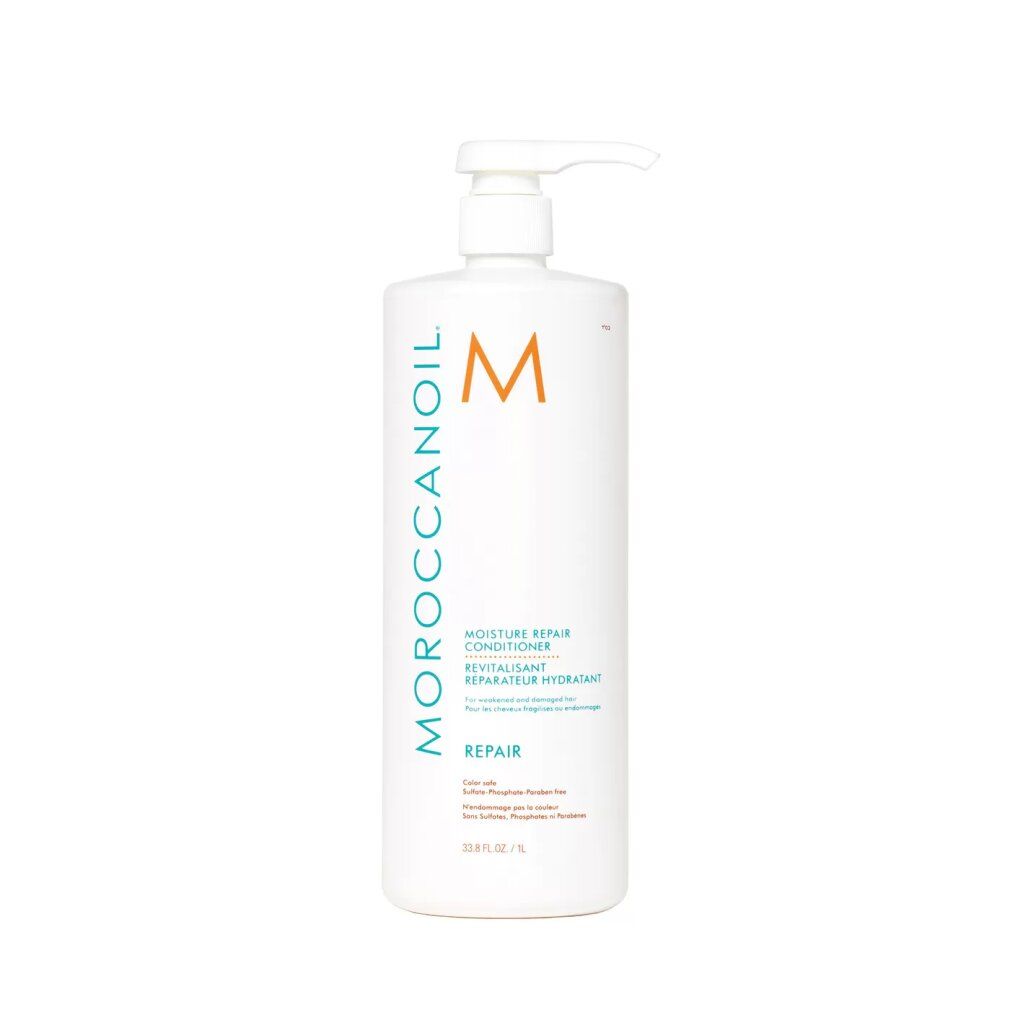 Flacone bianco con dosatore. Scritta: Moroccanoil, logo M, Revitalisant, Repair. Testo in inglese. Adesivo arancione.