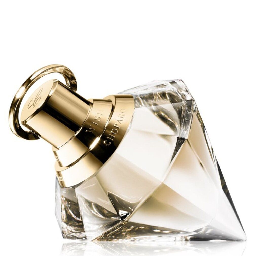 Flacone di profumo a forma di diamante, vetro trasparente, tappo dorato. Scritta: CHOPARD, WISH.