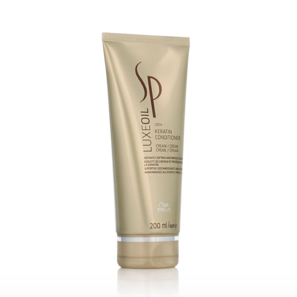 Tubo dorato di balsamo SP Luxe Oil Keratin. Logo e scritta. 200 ml. Base argentata.