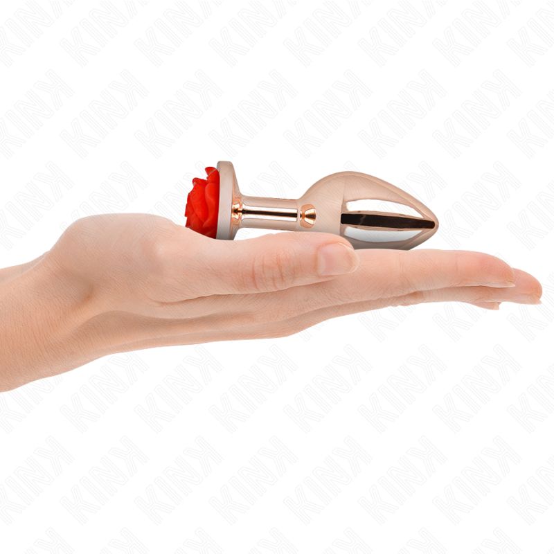 Plug anale con rosa rossa tenuto in mano. Colore oro rosa.