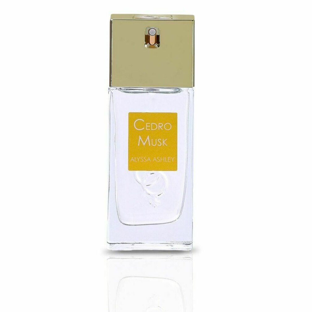 Flacone di profumo rettangolare con tappo dorato. Etichetta "Cedro Musk".