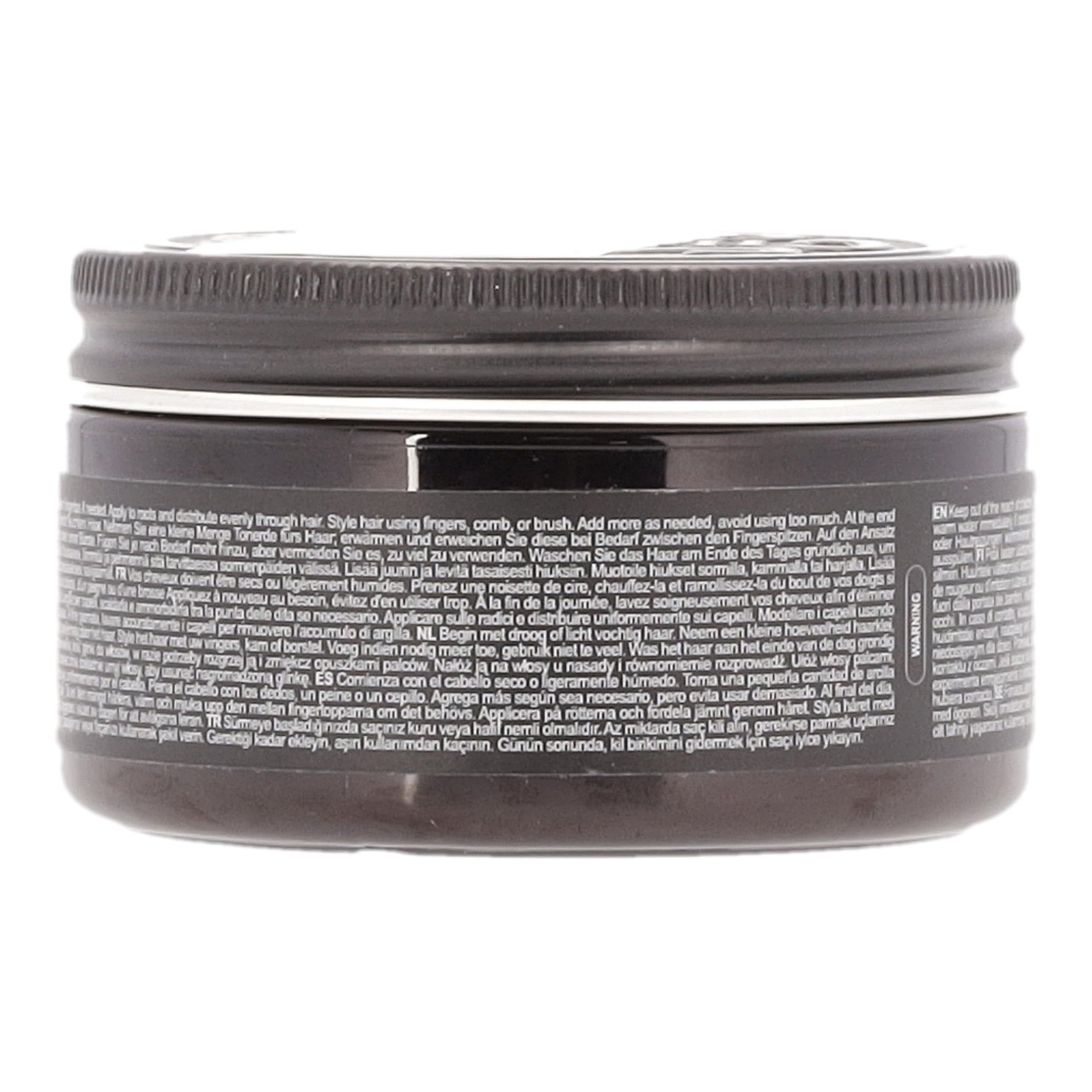 Coperchio nero con scritta argentata "CHARLE MAGN & PREMIUM GROOMING".