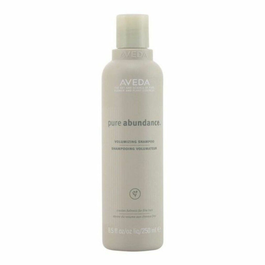 Flacone di shampoo beige. Scritta: Aveda, Pure Abundance, Volumizing Shampoo. 250 ml.